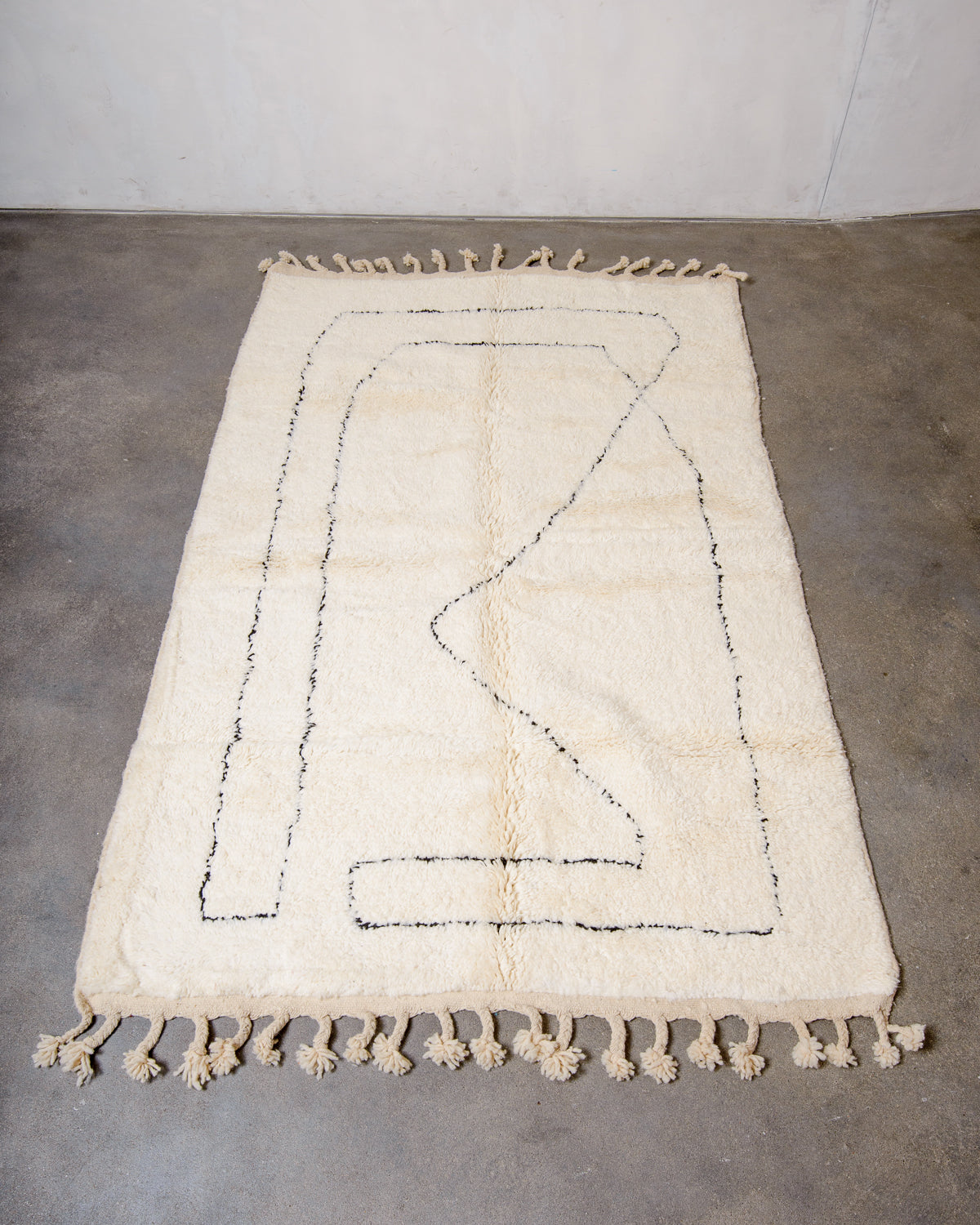 Modern, designer, handcrafted Berber rug from Morocco. Beniourain carpet with minimalist design, natural wool pile and a fluffy texture.
